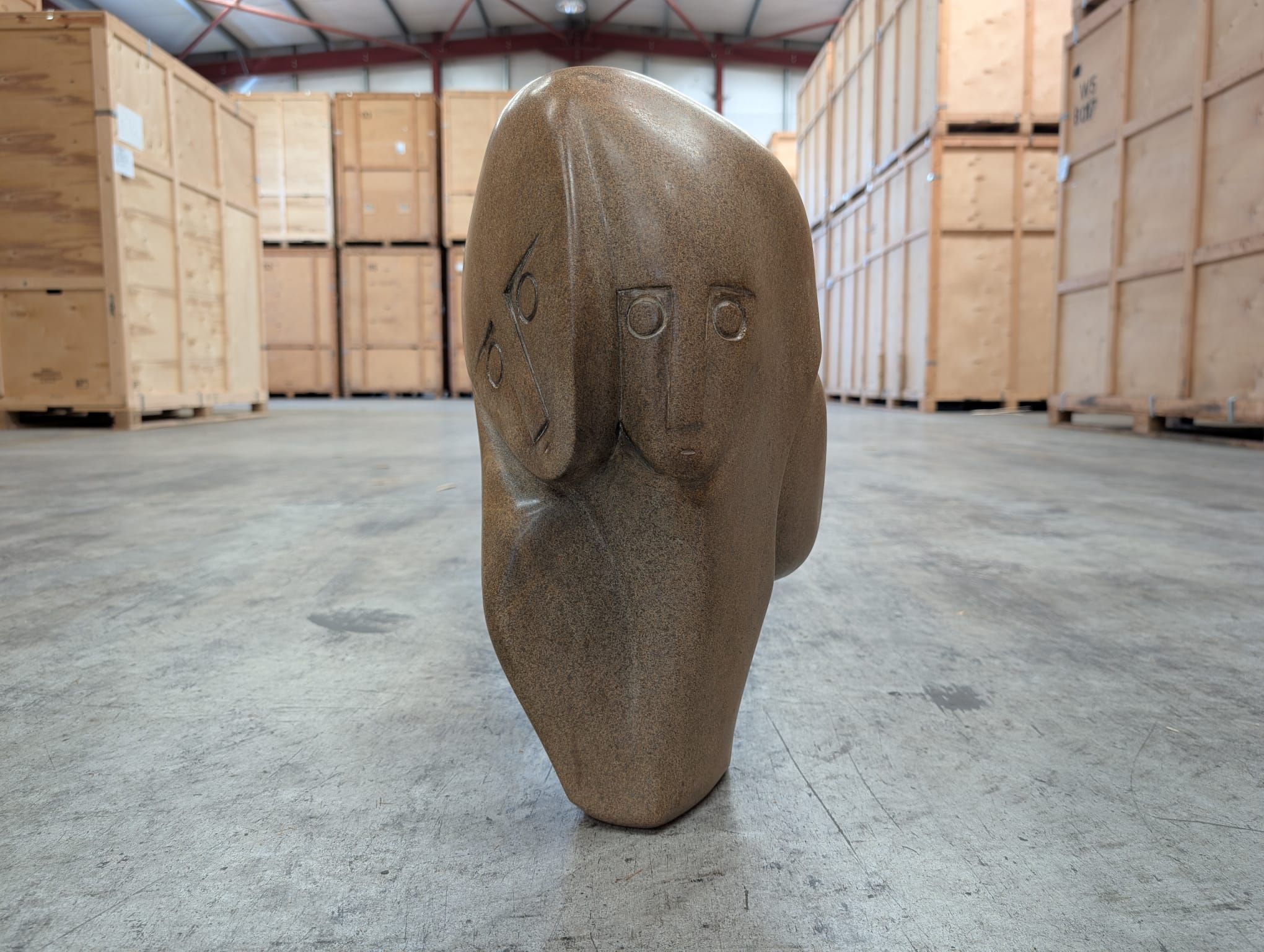 3 Faces, a stone sculpture by Henry Munyaradzi